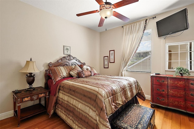 212 Crestrun Loop, Leesburg, FL 34748 - bedroom featuring wood finished floors, baseboards, and ceiling fan