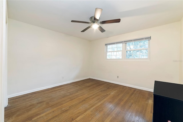 spare room featuring ceiling fan and hardwood / wood-style floors