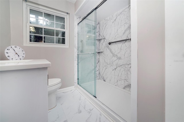 bathroom with a shower with door, vanity, and toilet