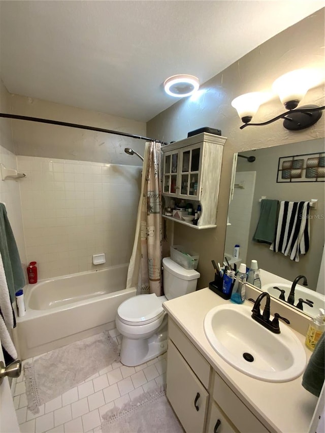 full bathroom featuring vanity, toilet, tile patterned floors, and shower / bath combo