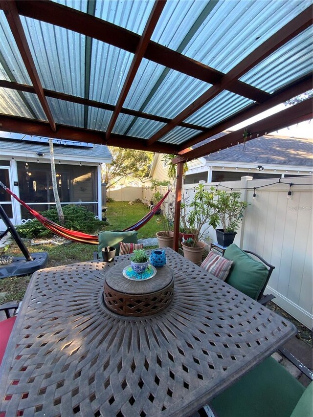 2939 Falling Tree Cir, Orlando, FL 32837 - view of patio featuring a sunroom and a fenced backyard