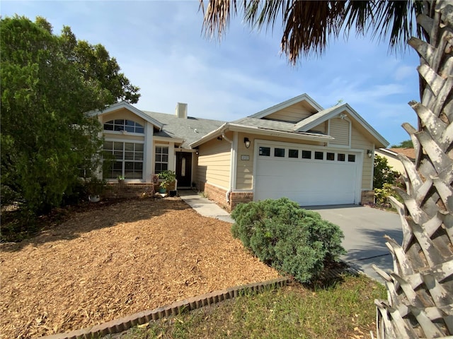 2939 Falling Tree Cir, Orlando, FL 32837 - view of front of property featuring brick siding, an attached garage, and concrete driveway