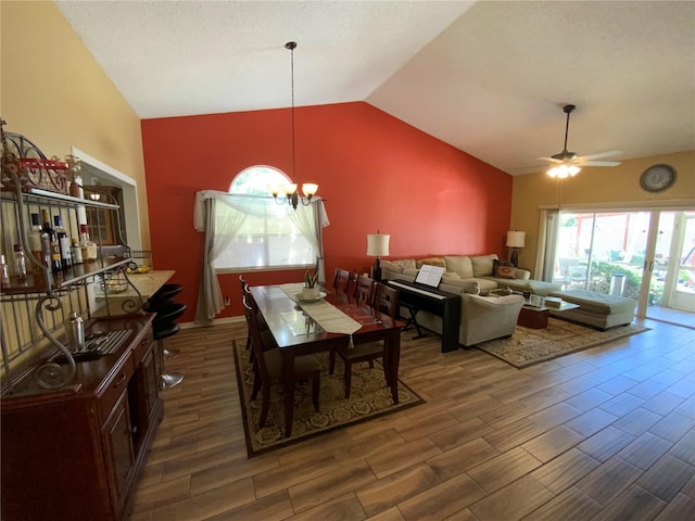 2939 Falling Tree Cir, Orlando, FL 32837 - living area with vaulted ceiling, a chandelier, ceiling fan, and wood finished floors