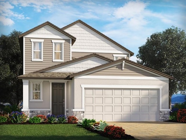 view of front of home with a front yard and a garage