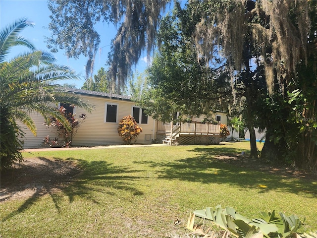 view of yard with a deck