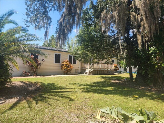 14902 Arrena Rd, Winter Garden, FL 34787 - view of grassy yard featuring a wooden deck