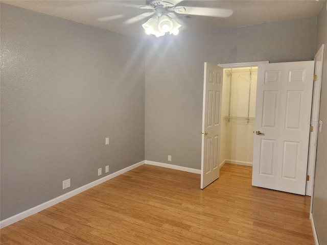 unfurnished bedroom featuring light hardwood / wood-style floors and ceiling fan