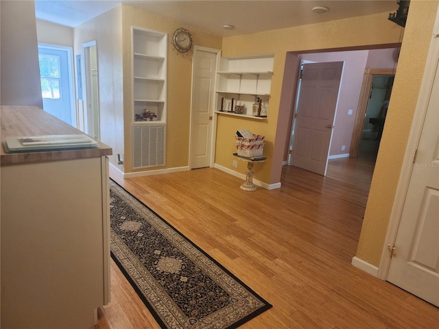 hall with light wood-type flooring