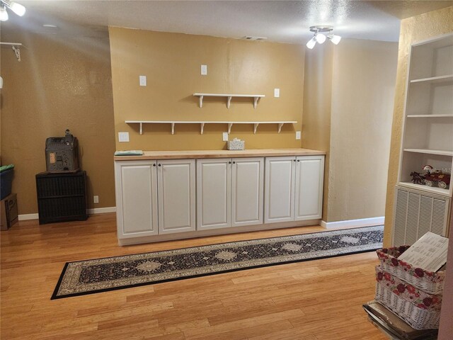 14902 Arrena Rd, Winter Garden, FL 34787 - bar area with light wood-style floors and baseboards