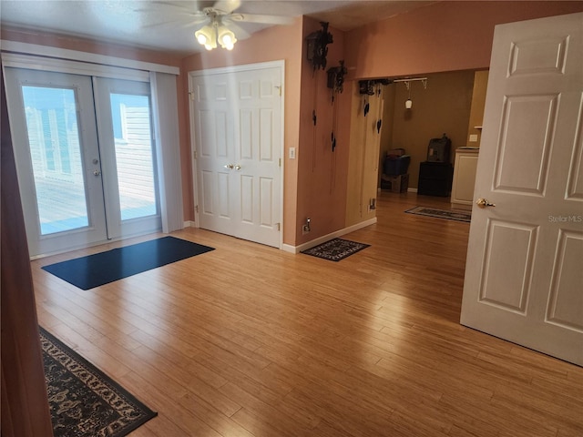 entrance foyer with french doors, ceiling fan, and light wood-type flooring