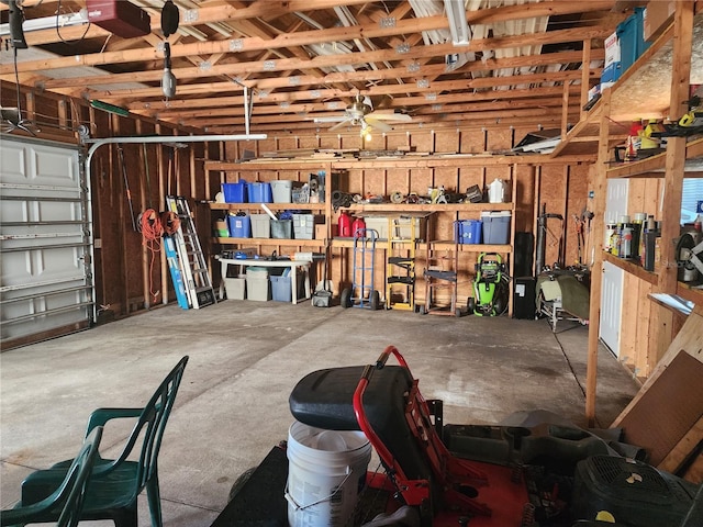 garage with a garage door opener and ceiling fan