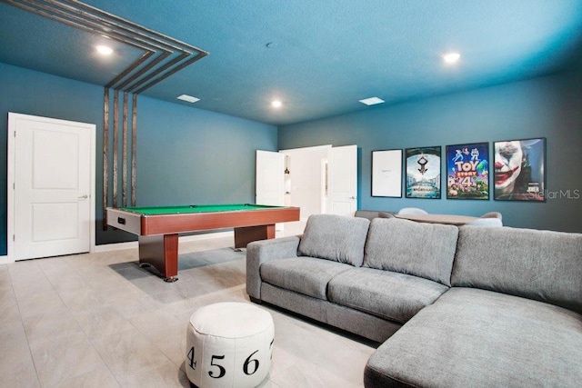 recreation room with billiards and a textured ceiling