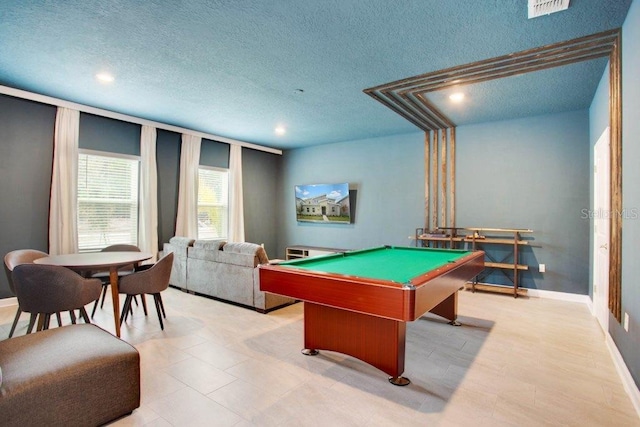 game room with billiards and a textured ceiling