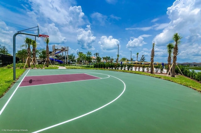 view of sport court featuring a water view