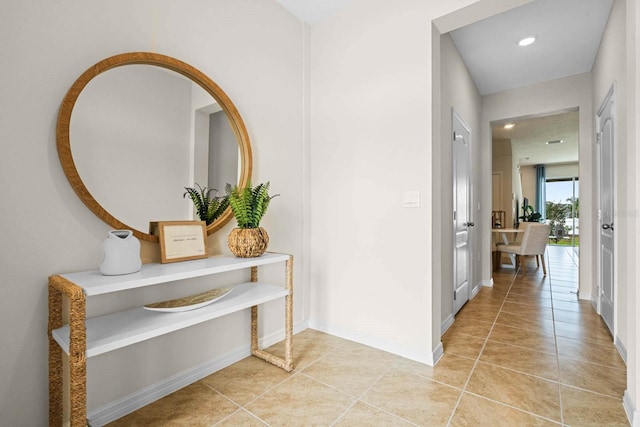 hallway with tile patterned flooring