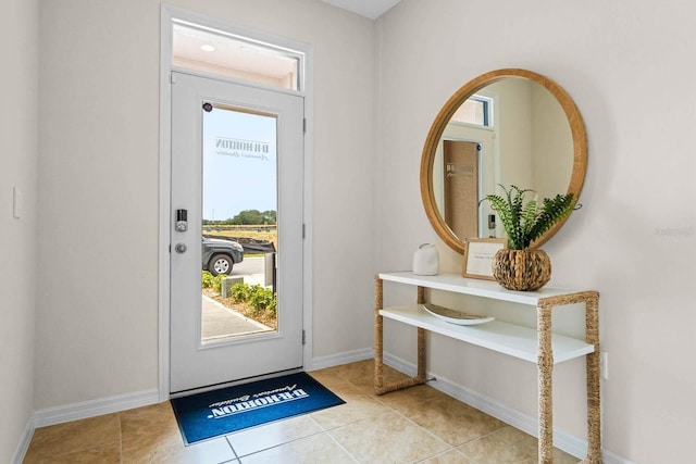 foyer entrance with light tile patterned floors