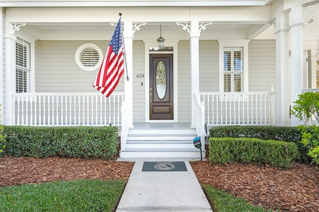 doorway to property with a porch