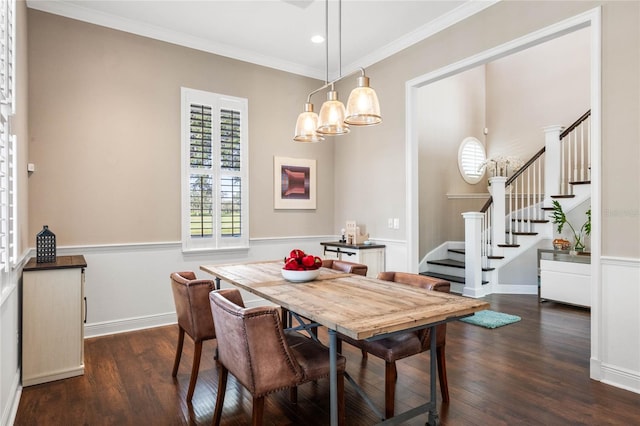 dining area featuring crown molding and dark wood-type flooring