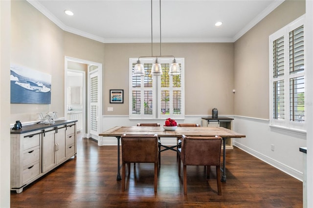 dining space featuring ornamental molding, dark wood-type flooring, and a chandelier