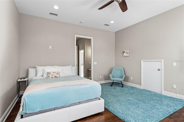 bedroom with ceiling fan and dark wood-type flooring