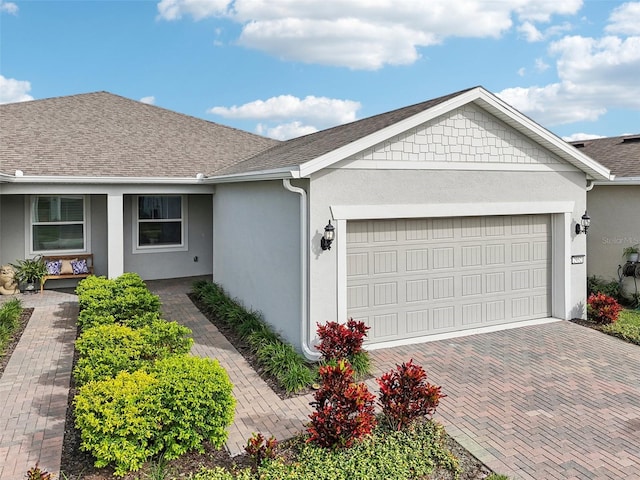 ranch-style house featuring a garage