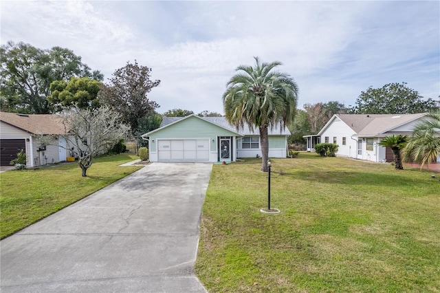 ranch-style house featuring a garage and a front lawn