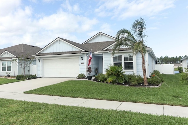 view of front of house featuring a front yard and a garage