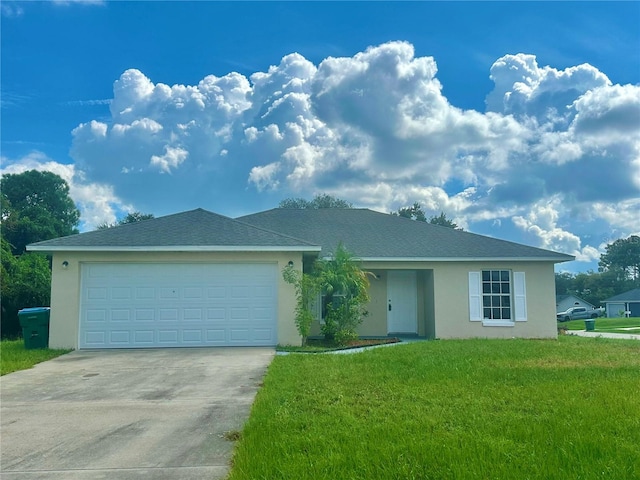 view of front of home featuring a front yard and a garage