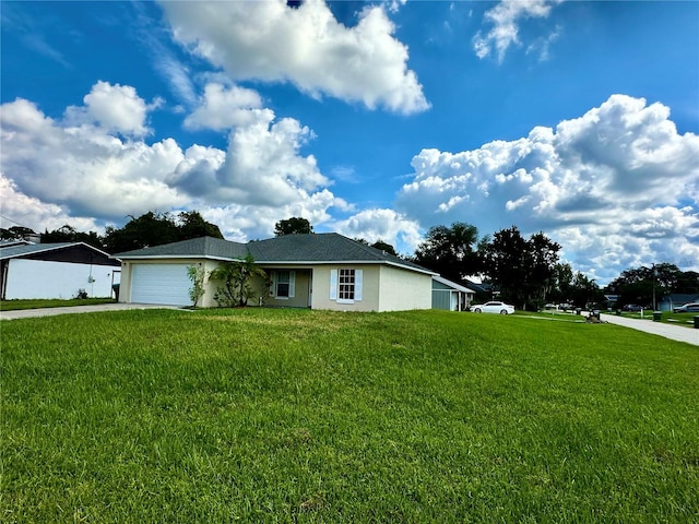 single story home with a garage and a front lawn