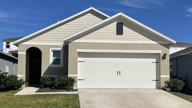 view of front of property with a garage