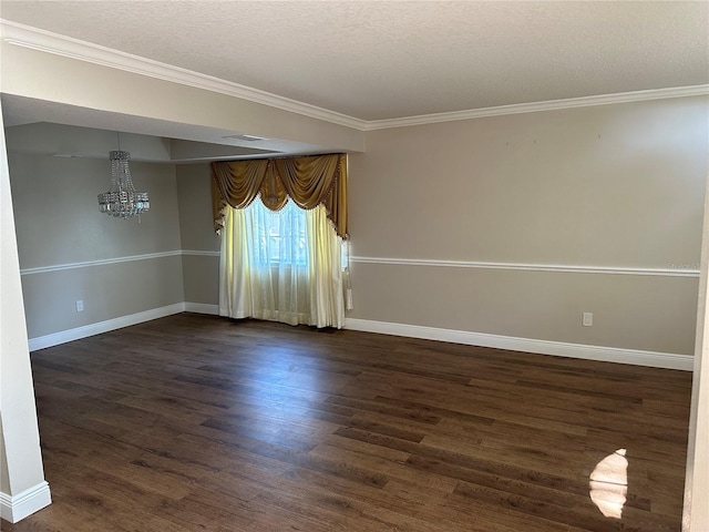 unfurnished room featuring dark wood-type flooring, ornamental molding, a chandelier, and a textured ceiling