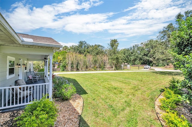 view of yard with covered porch