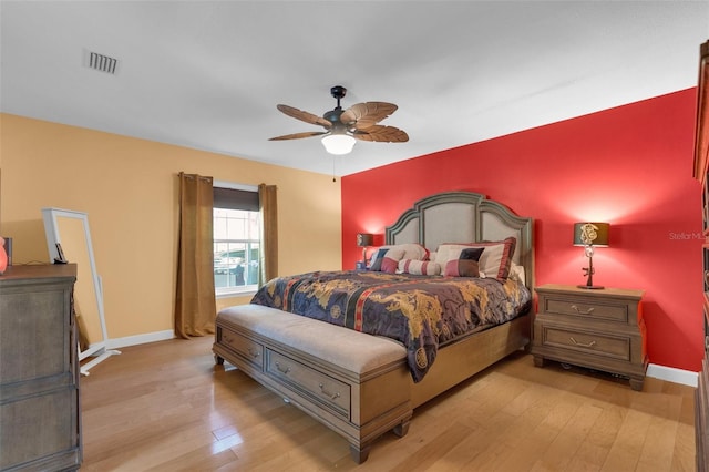 bedroom with light hardwood / wood-style floors and ceiling fan