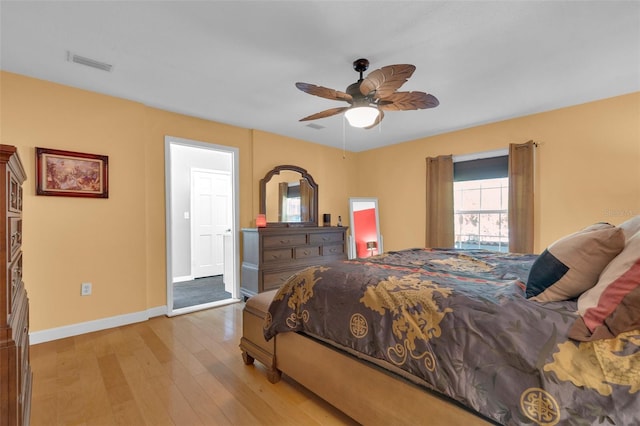 bedroom featuring light hardwood / wood-style floors and ceiling fan