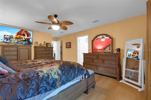 bedroom with ceiling fan and light wood-type flooring