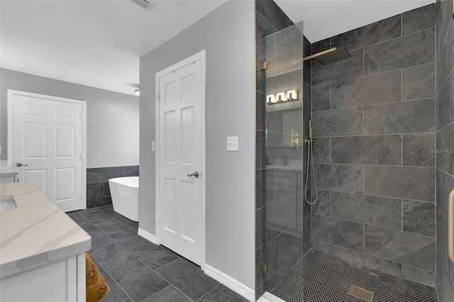 bathroom featuring vanity, tile patterned floors, and plus walk in shower