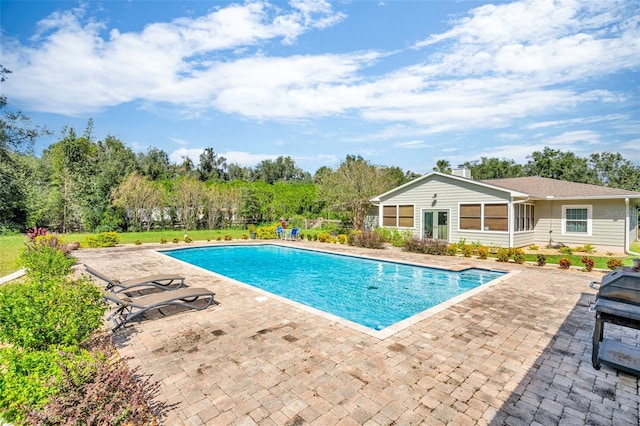 view of pool featuring a patio