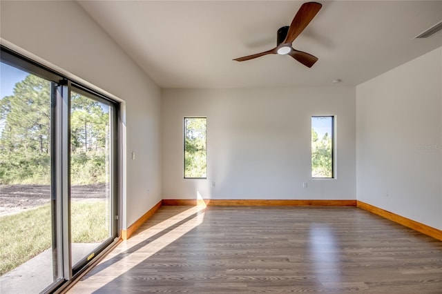 empty room with ceiling fan and wood-type flooring