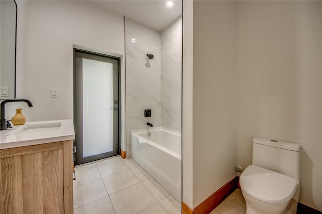 full bathroom featuring tile patterned floors, vanity, toilet, and tiled shower / bath combo