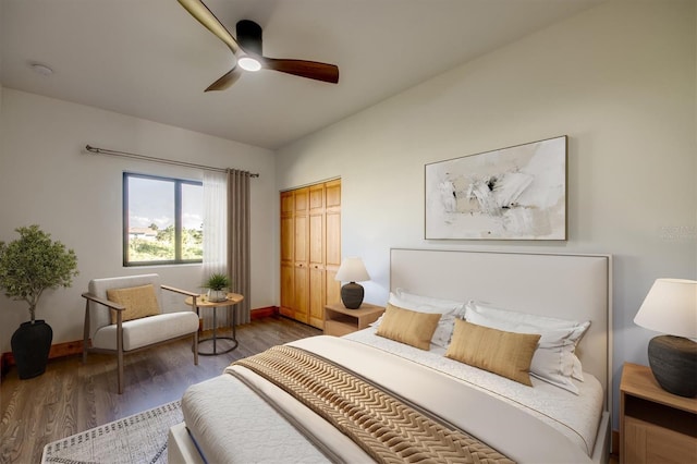 bedroom with dark hardwood / wood-style flooring, a closet, and ceiling fan