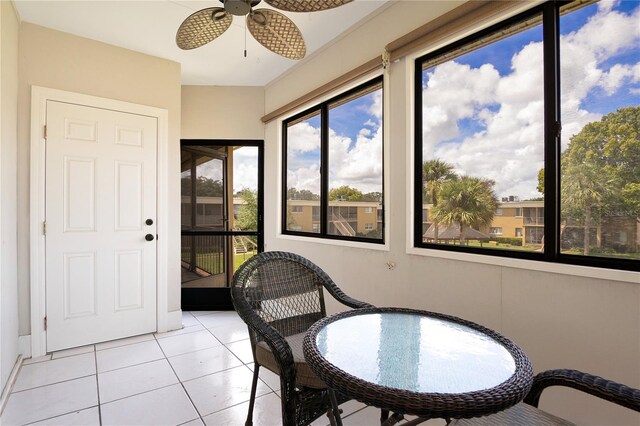 sunroom / solarium with ceiling fan