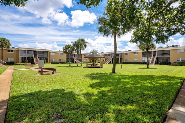 surrounding community featuring a gazebo and a yard