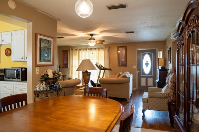 dining room featuring ceiling fan and hardwood / wood-style flooring