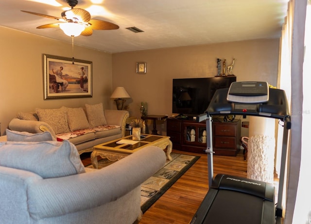 living room with ceiling fan and wood-type flooring