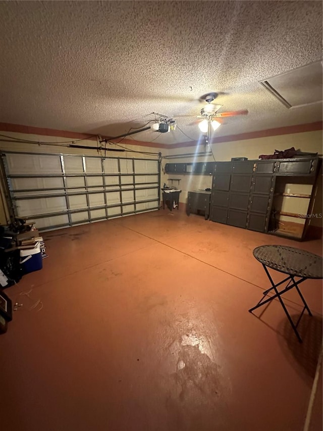 garage with a garage door opener and ceiling fan