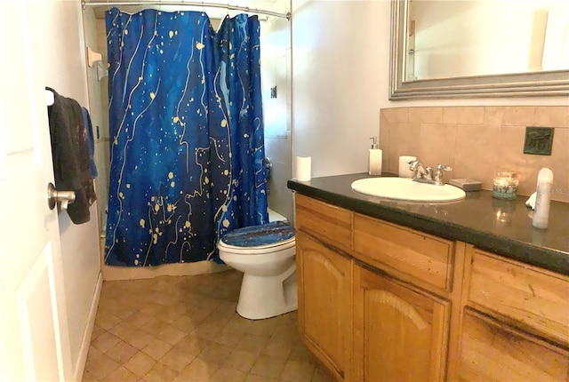 bathroom with vanity, tasteful backsplash, a shower with shower curtain, tile patterned flooring, and toilet