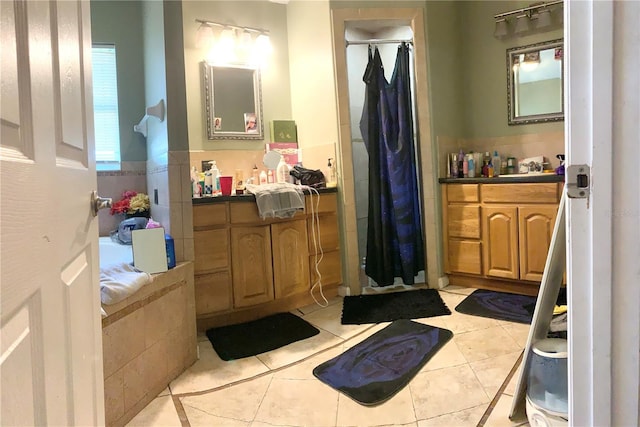 bathroom featuring tile patterned floors, vanity, and a shower with shower curtain