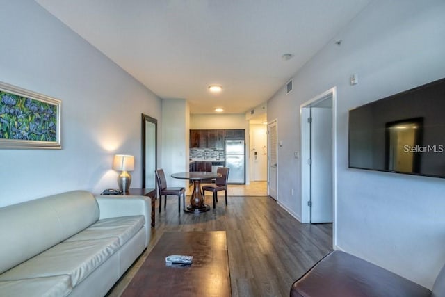 living room featuring dark wood-type flooring