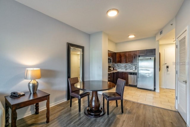 dining room featuring light hardwood / wood-style flooring