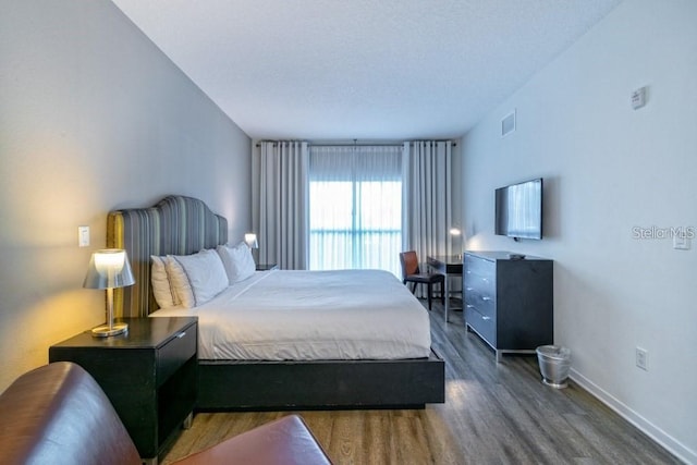 bedroom featuring dark hardwood / wood-style floors